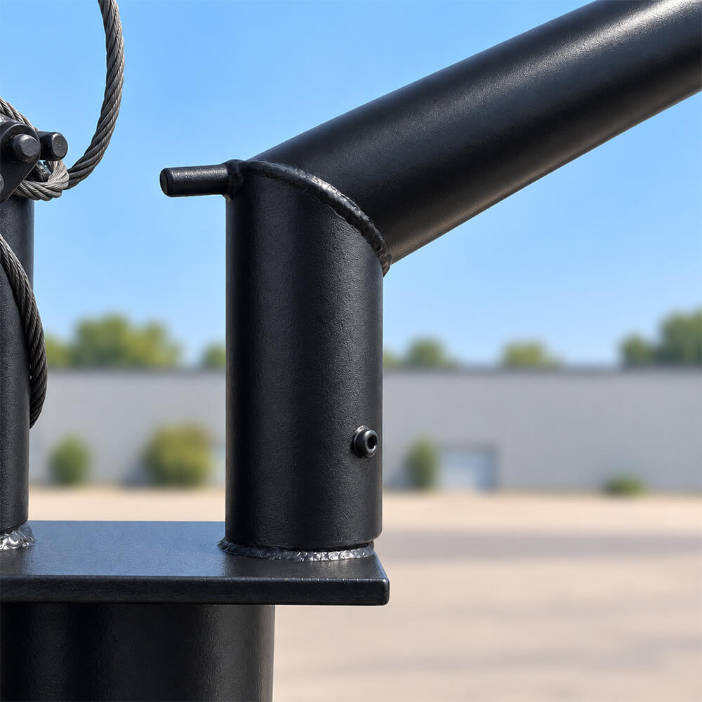 Close-up of a polished black 4-post shadeport bracket, curved hoop and secured steel cable.